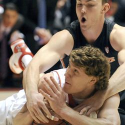 Utah Utes center Dallin Bachynski (31) calls timeout while fighting for a loose ball in front of Oregon State Beavers center Angus Brandt (12) during a game at the Jon M. Huntsman Center on Saturday, Jan. 4, 2014.
