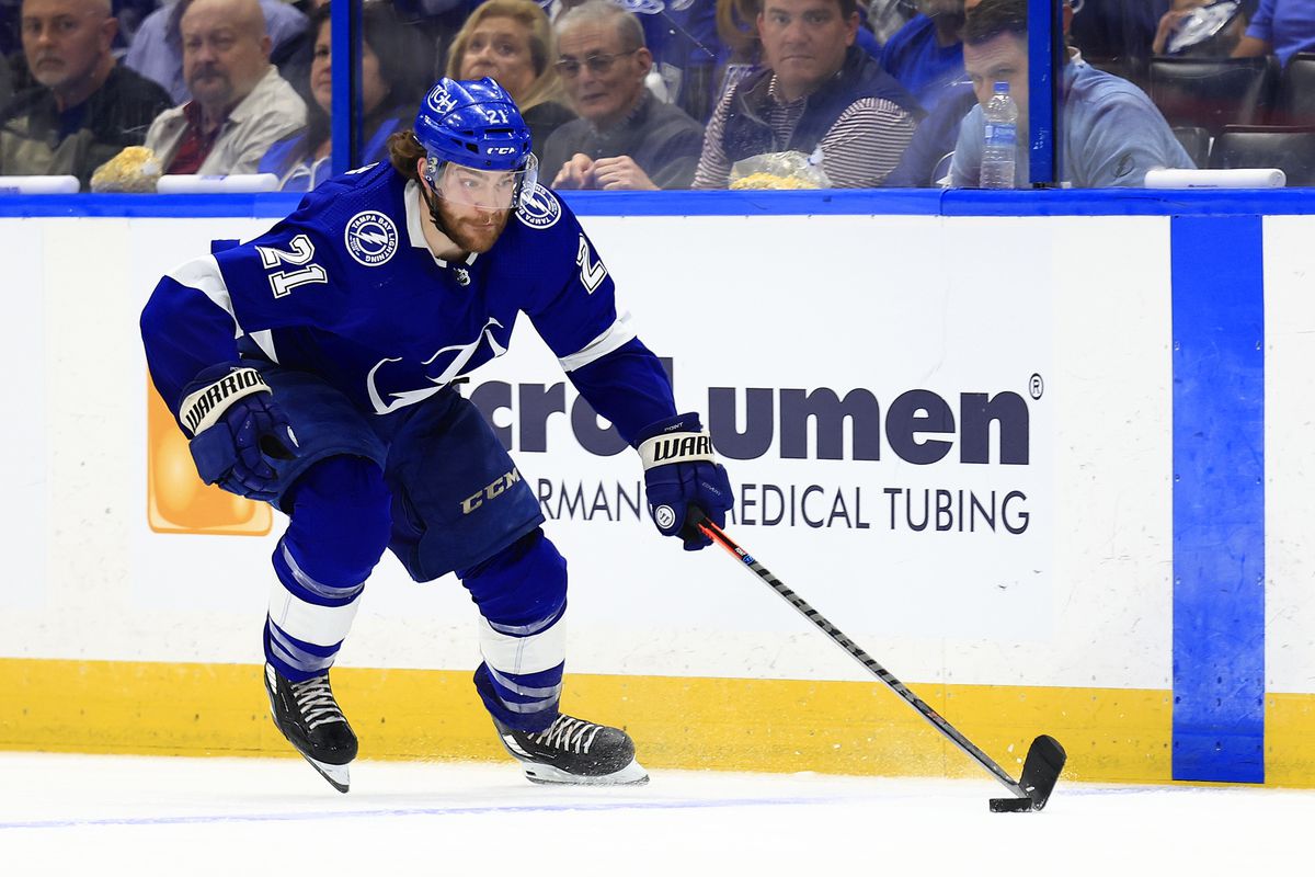 Brayden Point #21 of the Tampa Bay Lightning looks to pass in overtime during Game Five of the First Round of the 2022 Stanley Cup Playoffs against the Toronto Maple Leafs at Amalie Arena on May 12, 2022 in Tampa, Florida.