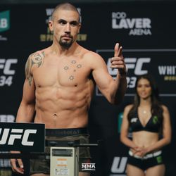 Robert Whittaker poses at UFC 234 weigh-ins.
