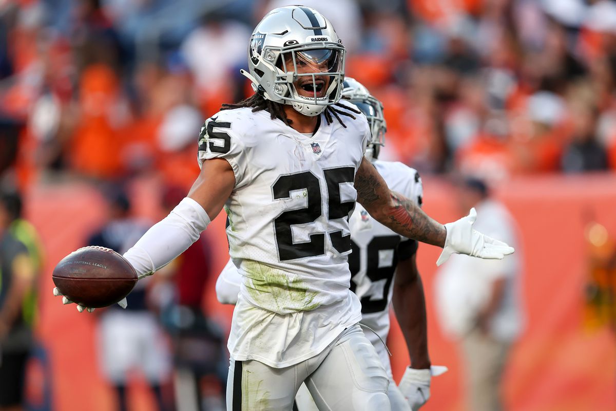 Las Vegas Raiders safety Trevon Moehrig celebrates after coming up with an interception during a NFL game between the Las Vegas Raiders and the Denver Broncos on October 17, 2021 at Empower Field at Mile High in Denver, CO.