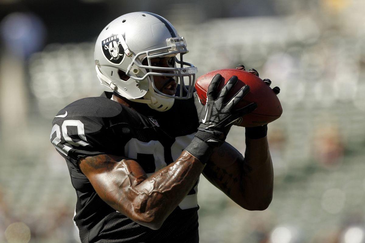 August 13, 2012; Oakland, CA, USA; Oakland Raiders running back Darren McFadden (20) catches a pass before the start of the game against the Dallas Cowboys at O.Co Coliseum. Mandatory Credit: Cary Edmondson-US PRESSWIRE