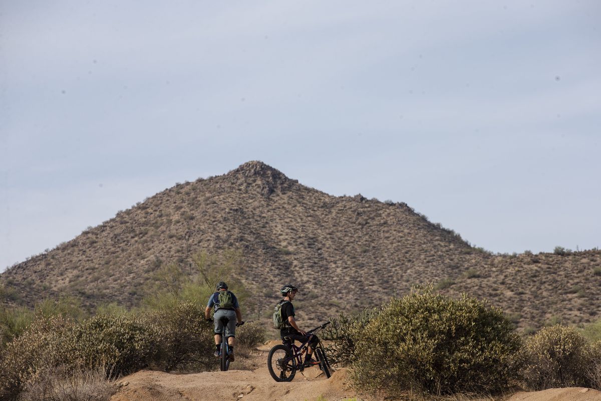 Mountain bikers enjoy the trails of Usery Mountain Regional Park and Tonto National Forest in Mesa on July 18, 2021.