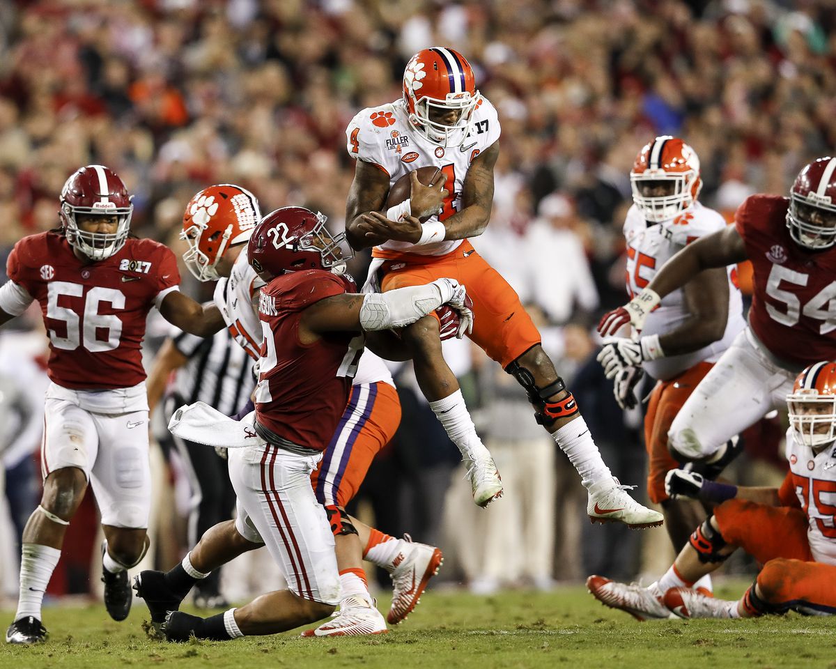 TAMPA, FL - JANUARY 09: Quarterback Deshaun Watson #4 of the Clemson Tigers is tackled by Linebacker Ryan Anderson #22 of the Alabama Crimson Tide during the 2017 College Football Playoff National Championship Game at Raymond James Stadium on January 9, 2017 in Tampa, Florida. The Clemson Tigers defeated The Alabama Crimson Tide 35 to 31. (Photo by Don Juan Moore/Getty Images)