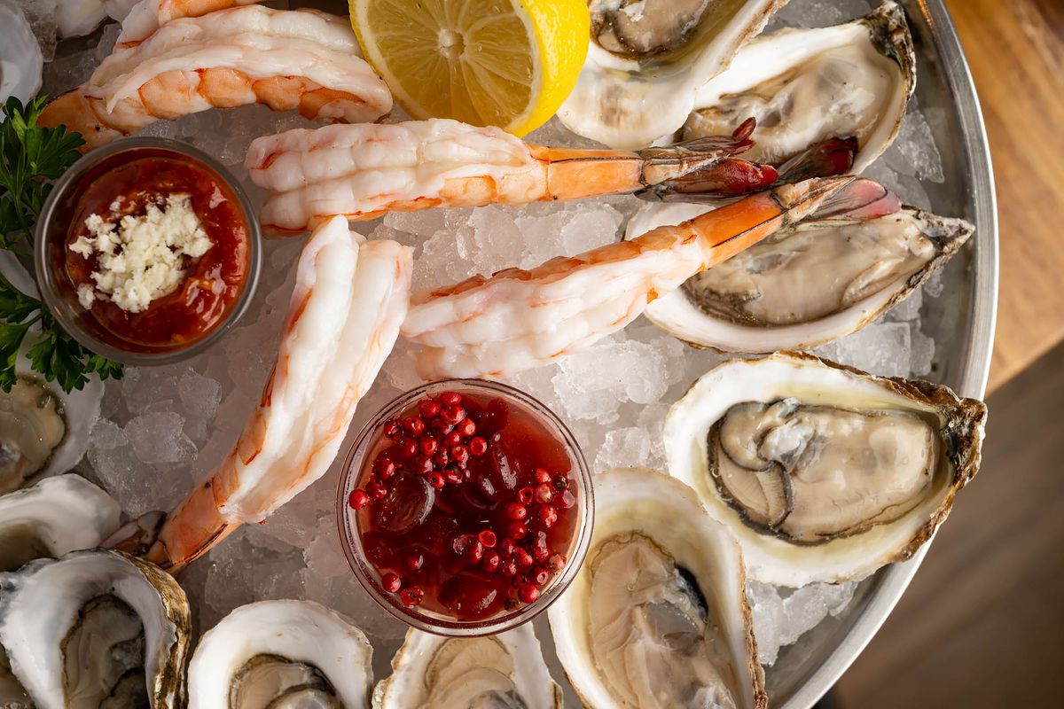 Shrimp and raw oysters over ice at Hudson House restaurant in West Hollywood, California.