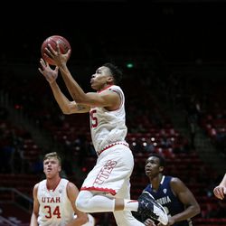 Utah Utes guard Lorenzo Bonam (15) lays it up during a game against Concordia at the Hunstman Center in Salt Lake City on Tuesday, Nov. 15, 2016.