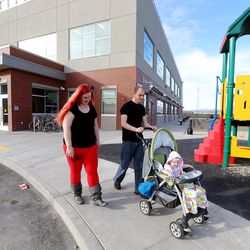 Kyle Hansen and his wife, Jerika Johnson, take a short walk with their daughter, Rose Hansen, Kyle Hansen and his wife, Jerika Johnson, play with their daughter, Rose Hansen, at the Road Home’s new Midvale Center, an emergency homeless shelter for families, on Wednesday on  March 9, 2016.
