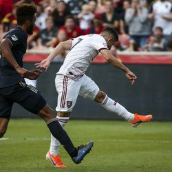 Real Salt Lake forward Jefferson Savarino (7) scores while defended by Philadelphia Union defender Auston Trusty (26) during the first half of a game at Rio Tinto Stadium in Sandy on Saturday, July 13, 2019.