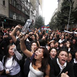 Chilean students march through the streets demanding free education, in Santiago, Chile, Thursday, April. 11, 2013.  The marches began during the Michelle Bachelet government and have troubled President Sebastian Pinera even more. Pinera's government is focusing a chunk of the 2013 budget on financing school loans at lower rates. But students say the system still fails them, with poor public schools, expensive private universities, unprepared teachers and unaffordable loans. (AP Photo/Luis Hidalgo)