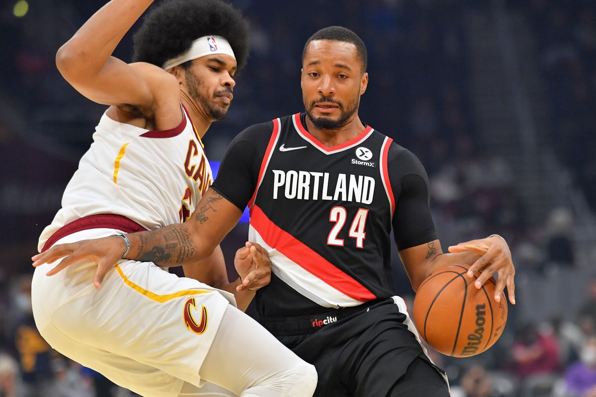Norman Powell #24 of the Portland Trail Blazers drives against Jarrett Allen #31 of the Cleveland Cavaliers during the first half at Rocket Mortgage Fieldhouse on November 03, 2021 in Cleveland, Ohio.