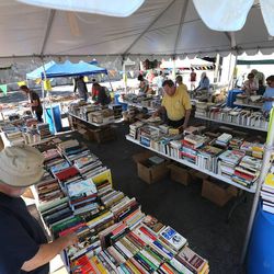 Central Book Exchange in Sugar House hosts an annual book sale Saturday, Aug, 3, 2013, with over 50,000 books. Many of the books had been boxed for 10 to 25 years.