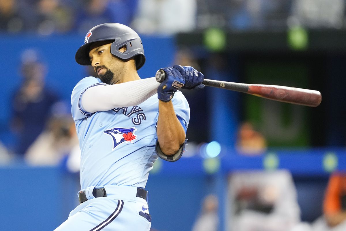 Marcus Semien #10 of the Toronto Blue Jays swings against the Baltimore Orioles in the first inning during their MLB game at the Rogers Centre on October 3, 2021 in Toronto, Ontario, Canada.