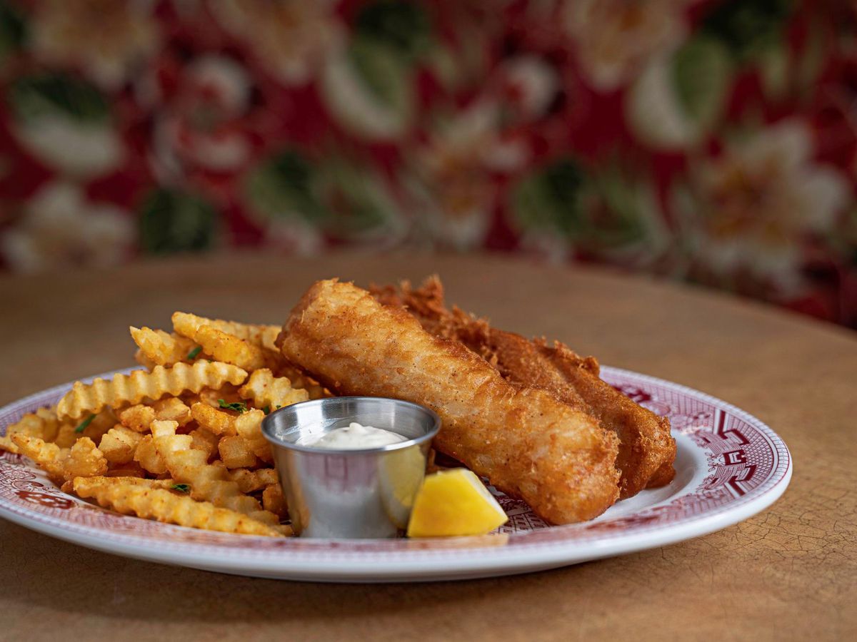 A plate of fish and crinkle cut fries