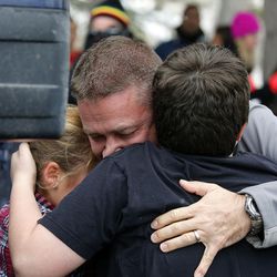 Families are reunited as students are released from Mueller Park Junior High School in Bountiful on Thursday, Dec. 1, 2016, following a shooting incident at the school.
