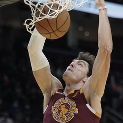 Cleveland Cavaliers’ Cedi Osman dunks against the Utah Jazz in the second half of an NBA basketball game, Sunday, Dec. 5, 2021, in Cleveland. 