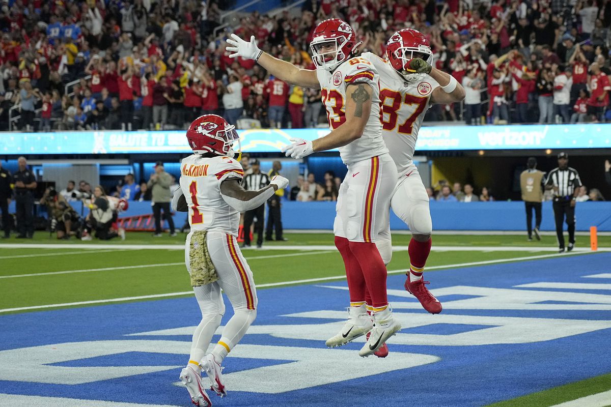 Travis Kelce #87 of the Kansas City Chiefs celebrates a touchdown with Jerick McKinnon #1 and Noah Gray #83 of the Kansas City Chiefs at SoFi Stadium on November 20, 2022 in Inglewood, California.