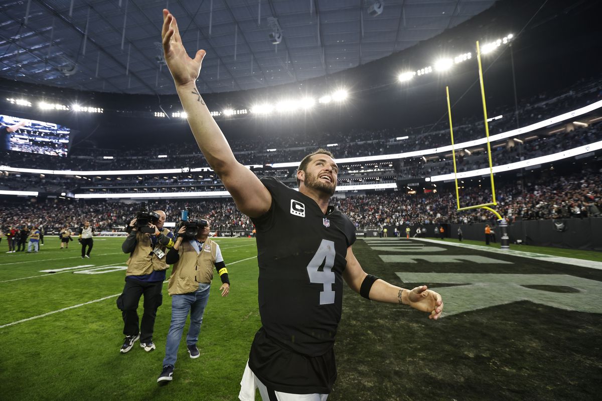 Derek Carr #4 of the Las Vegas Raiders celebrates after defeating the New England Patriots following an NFL football game between the Las Vegas Raiders and the New England Patriots at Allegiant Stadium on December 18, 2022 in Las Vegas, Nevada.