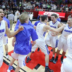 Bingham players celebrate their 61-44 win over Copper Hills in the 5A basketball championship in the Huntsman Center at the University of Utah Saturday, March 5, 2016.