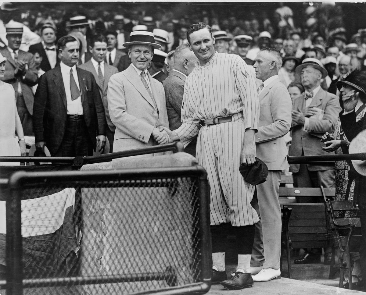 U.S. President Calvin Coolidge Shaking Hands with Washington Senators Pitcher, Walter Johnson, Griffith Stadium, Washington DC, USA, circa 1925