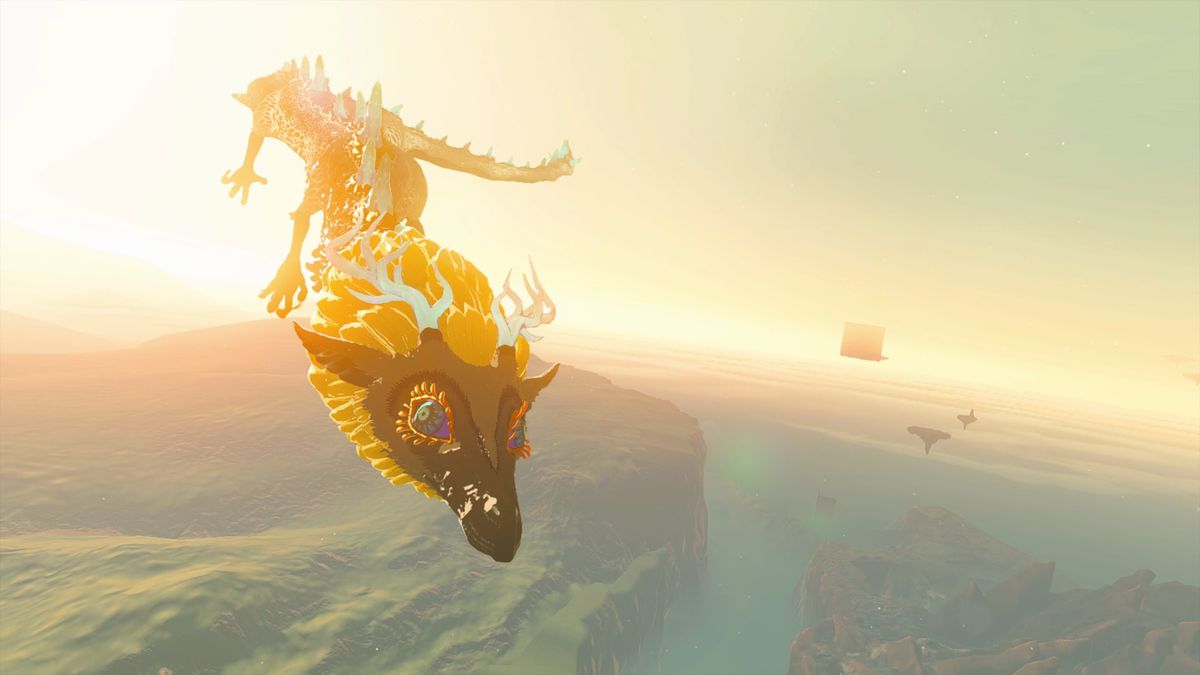 The Light Dragon, with flowing yellow hair, ethereal blue horns and dorsal scales, flies through the skies of Hyrule