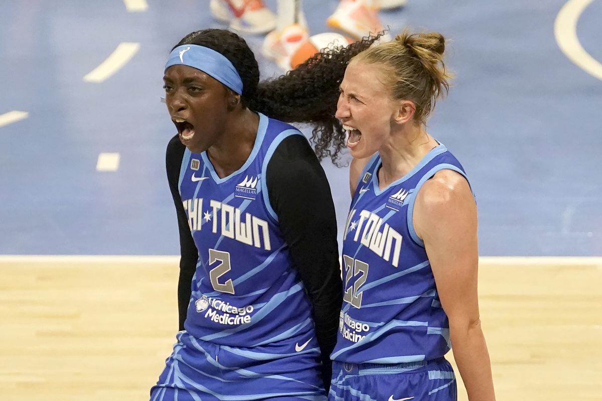Chicago Sky’s Kahleah Copper (2) celebrates with Courtney Vandersloot after Vandersloot was fouled and scored in the act of shooting during the second half of a WNBA basketball game against the Connecticut Sun Thursday, June 17, 2021, in Chicago. The Sky won 81-75. (AP Photo/Charles Rex Arbogast) ORG XMIT: ILCA108