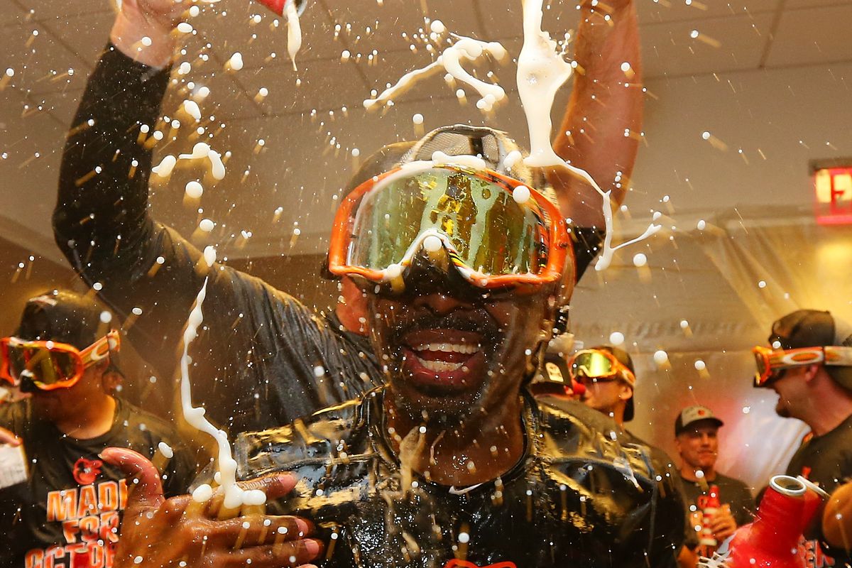 Michael Bourn is drenched by beer as the Orioles celebrate clinching a postseason berth.