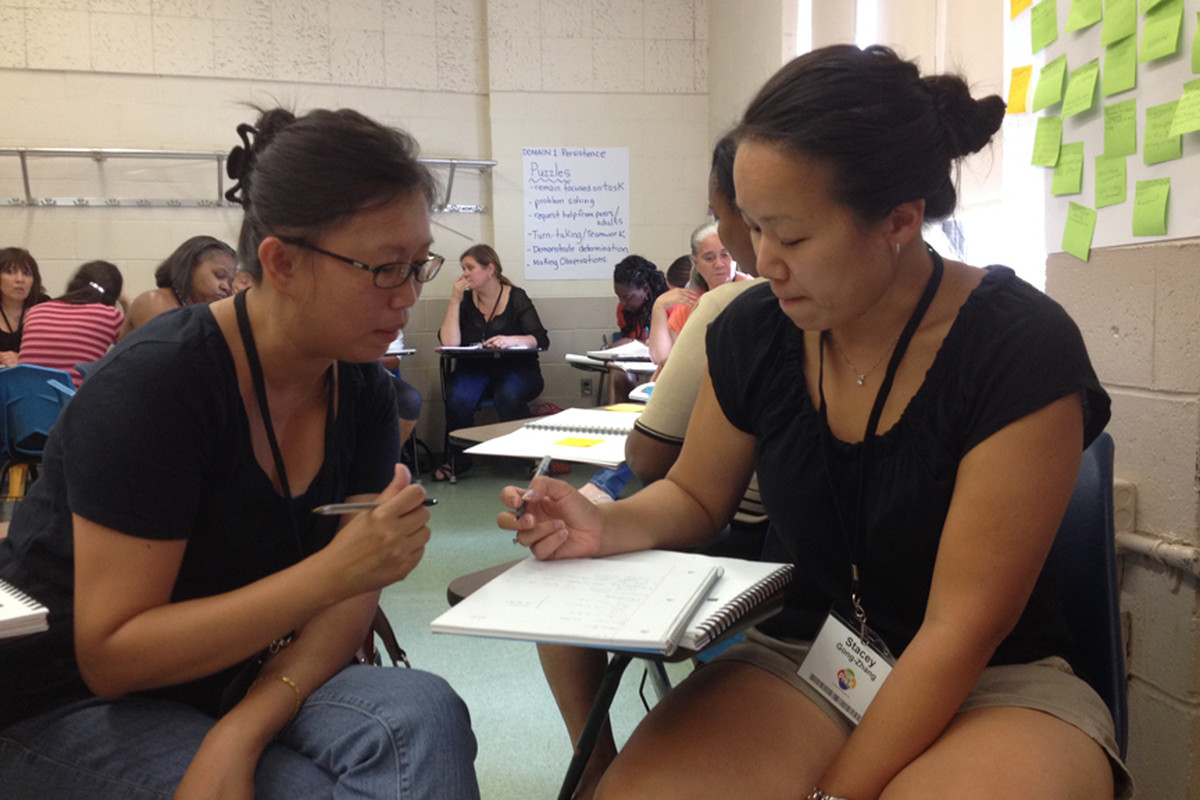 Janet Lo (left) and Stacey Gong-Zhang attend a training program for pre-K teachers.