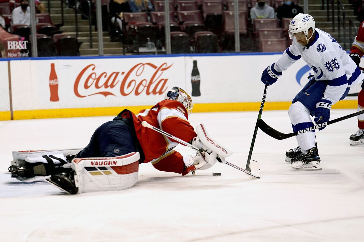 Panthers goaltender Chris Driedger, left, defends the goal against the Lightning’s Daniel Walcott (85) during the first period of Monday’s game.