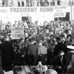 Signs and banners greet President John F. Kennedy as he arrives in Salt Lake City for a visit in 1963.