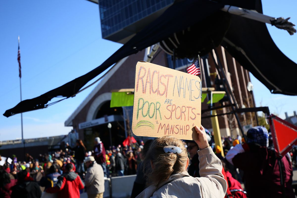 Protesters demonstrate at a Washington Redskins game in 2014.
