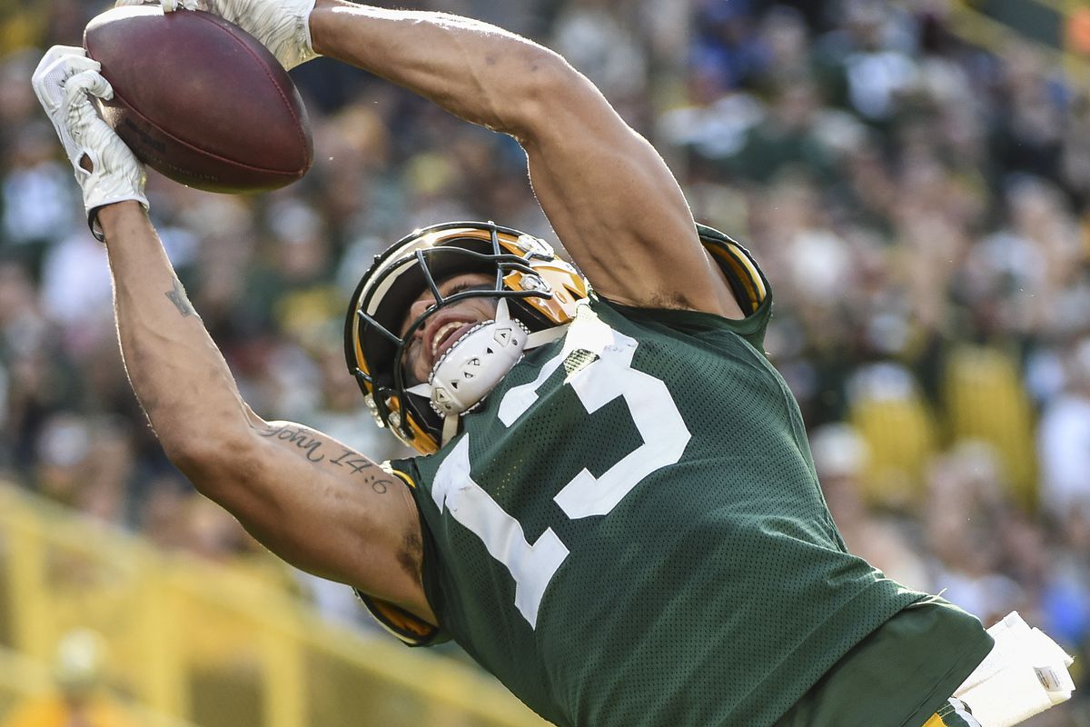 Green Bay Packers wide receiver Allen Lazard stretches to catch a deep pass in the third quarter during the game against the Oakland Raiders at Lambeau Field.