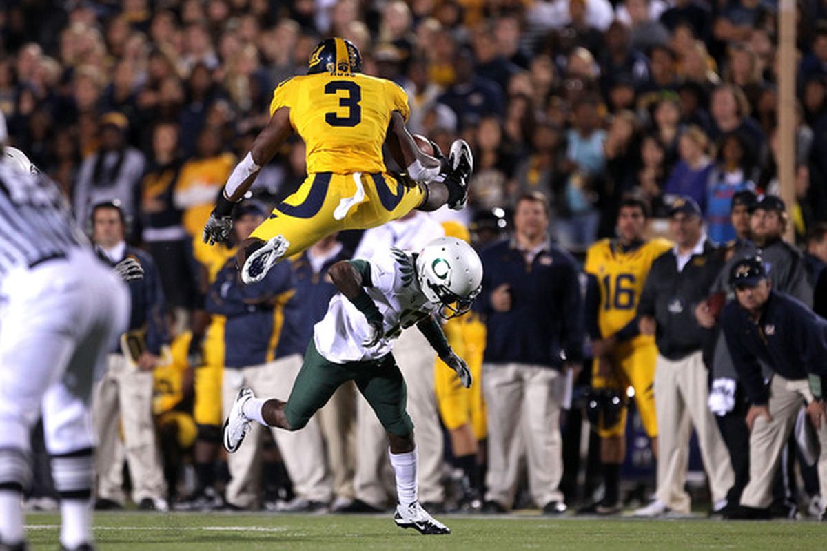 BERKELEY CA - NOVEMBER 13:  Jeremy Ross #3 of the California Golden Bears jumps over Cliff Harris #13 of the Oregon Ducks at California Memorial Stadium on November 13 2010 in Berkeley California.  (Photo by Ezra Shaw/Getty Images)