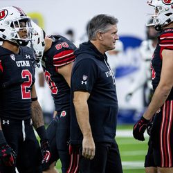 Utah Utes head coach Kyle Whittingham and players prepare to face the Oregon Ducks in the Pac-12 championship game at Allegiant Stadium in Las Vegas on Friday, Dec. 3, 2021.