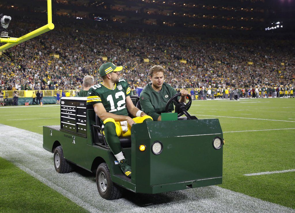 Green Bay Packers’ Aaron Rodgers is taken off the field on a cart after injuring his leg during the first half of an NFL football game against the Chicago Bears Sunday, Sept. 9, 2018, in Green Bay, Wis. | AP Photo/Jeffrey Phelps