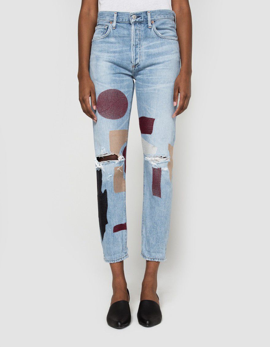 light wash jeans with painted shapes on them