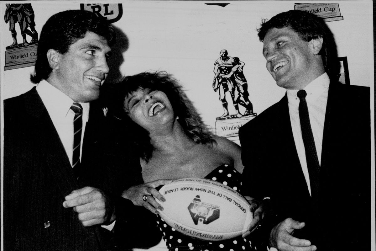 Tina Turner at A Press Conference at The Intercontinental Hotel for the promotion of The Rugby League.Tina Turner with Balmain Captain Wayne Pearce. And Mario French.