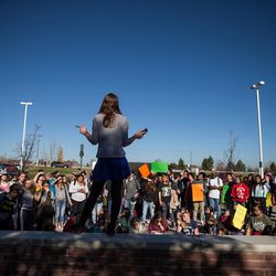 Students gather outside Copper Hills High School in West Jordan on Thursday, Nov. 10, 2016, during a walkout to protest the election of Donald Trump as president.