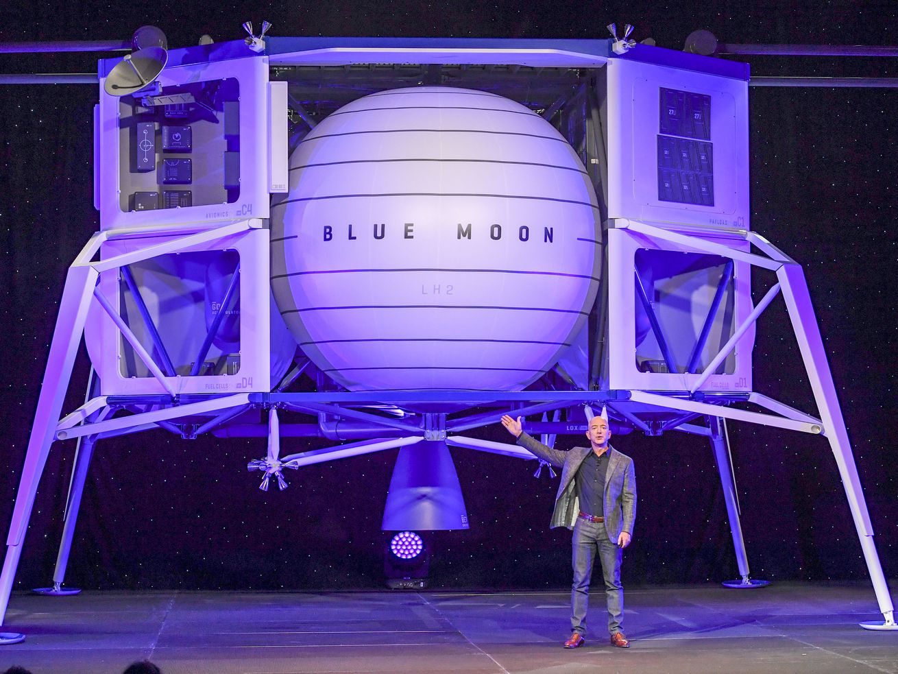 Jeff Bezos, founder of Amazon and Blue Origin, stands in front of the newly developed lunar lander “Blue Moon” at the Walter E. Washington Convention Center.