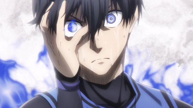 A closeup of Isagi Yoichi in Blue Lock. He glares forward, one hand on his sweating face as right eye radiates blue power.