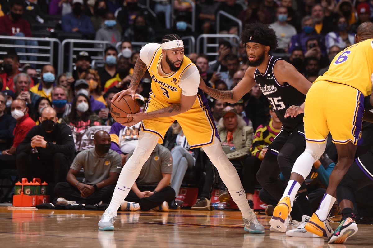 Anthony Davis #3 of the Los Angeles Lakers handles the ball against the Sacramento Kings on November 26, 2021 at STAPLES Center in Los Angeles, California.