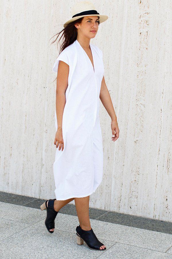A woman in an oversized white dress
