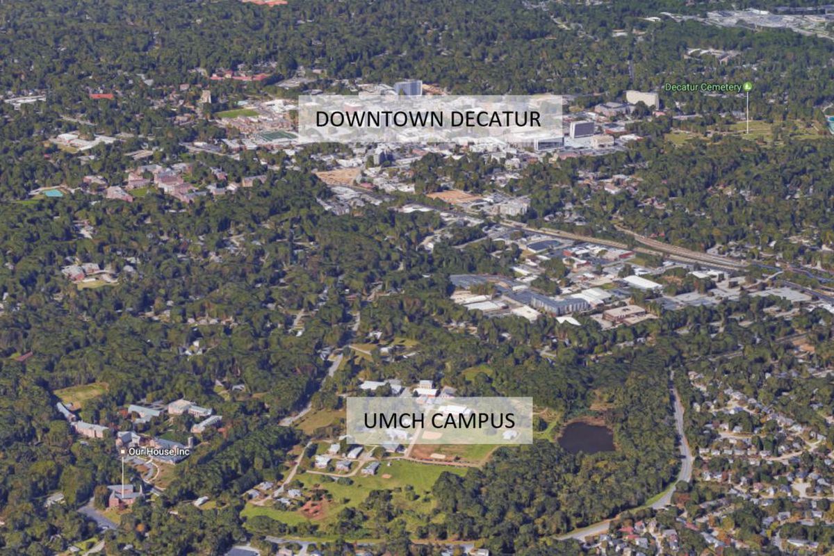 An aerial view showing the large, green campus in relationship to downtown Decatur, just to the northwest.