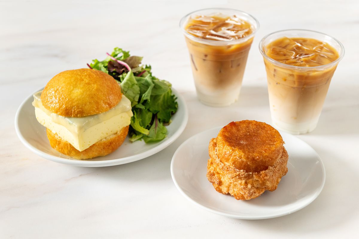 Breakfast pastries and sandwiches with iced coffees