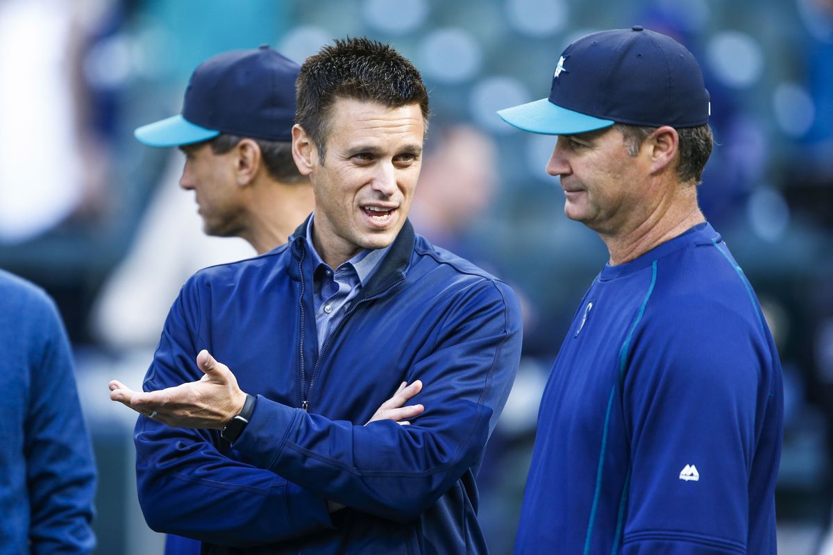Apr 25, 2016; Seattle, WA, USA; Seattle Mariners manager Scott Servais (9, right) talks with general manager Jerry Dipoto during batting practice before a game against the Houston Astros at Safeco Field. Mandatory Credit: Joe Nicholson-USA TODAY Sports