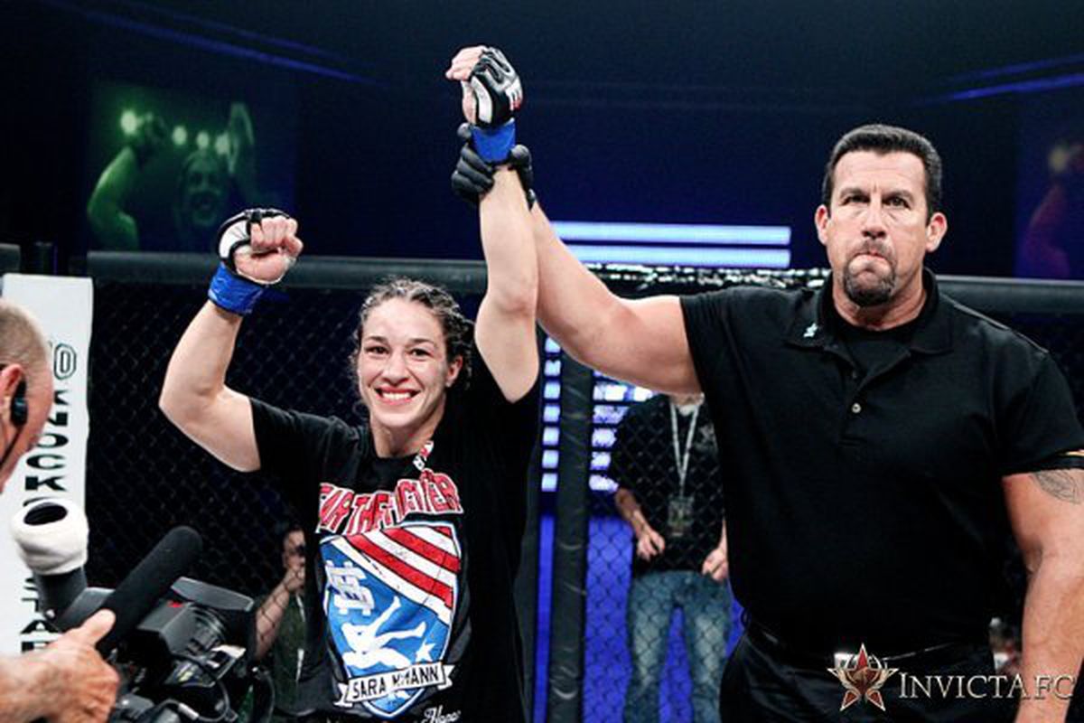 Sara McMann gets her hand raised in victory after defeating Shayna Baszler at Invicta FC 2. Photo by Esther Lin via Invicta FC