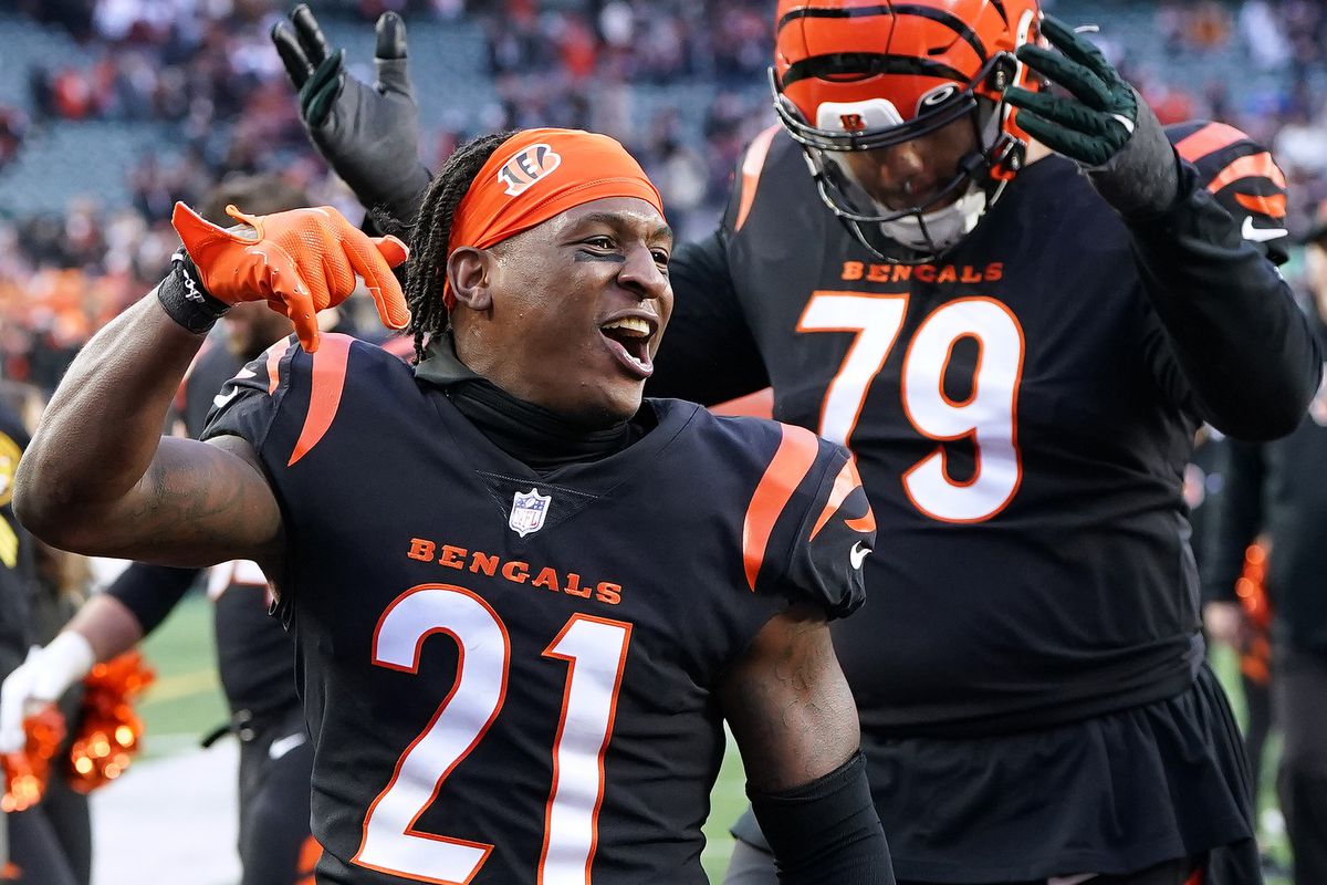 Mike Hilton #21 and Jackson Carman #79 of the Cincinnati Bengals celebrate after defeating the Baltimore Ravens 27-16 at Paycor Stadium on January 08, 2023 in Cincinnati, Ohio.