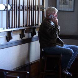 Libertarian vice presidential candidate Gov. Bill Weld catches up on phone calls while at the Alta Club as he and Gov. Gary Johnson pay a visit to Salt Lake City for a speech at the University of Utah on Saturday, Aug. 6, 2016.