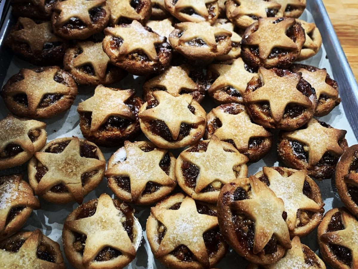 Dozens of mini mince pies with a star shape on each of them. 