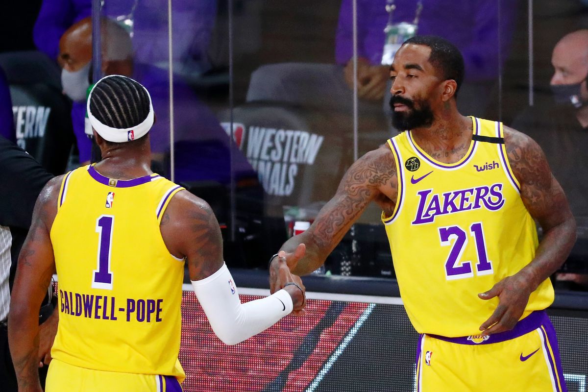 Los Angeles Lakers guard Kentavious Caldwell-Pope and guard JR Smith shake hands during the fourth quarter in game one of the Western Conference Finals of the 2020 NBA Playoffs against the Denver Nuggets at AdventHealth Arena. The Los Angeles Lakers won 126-114.