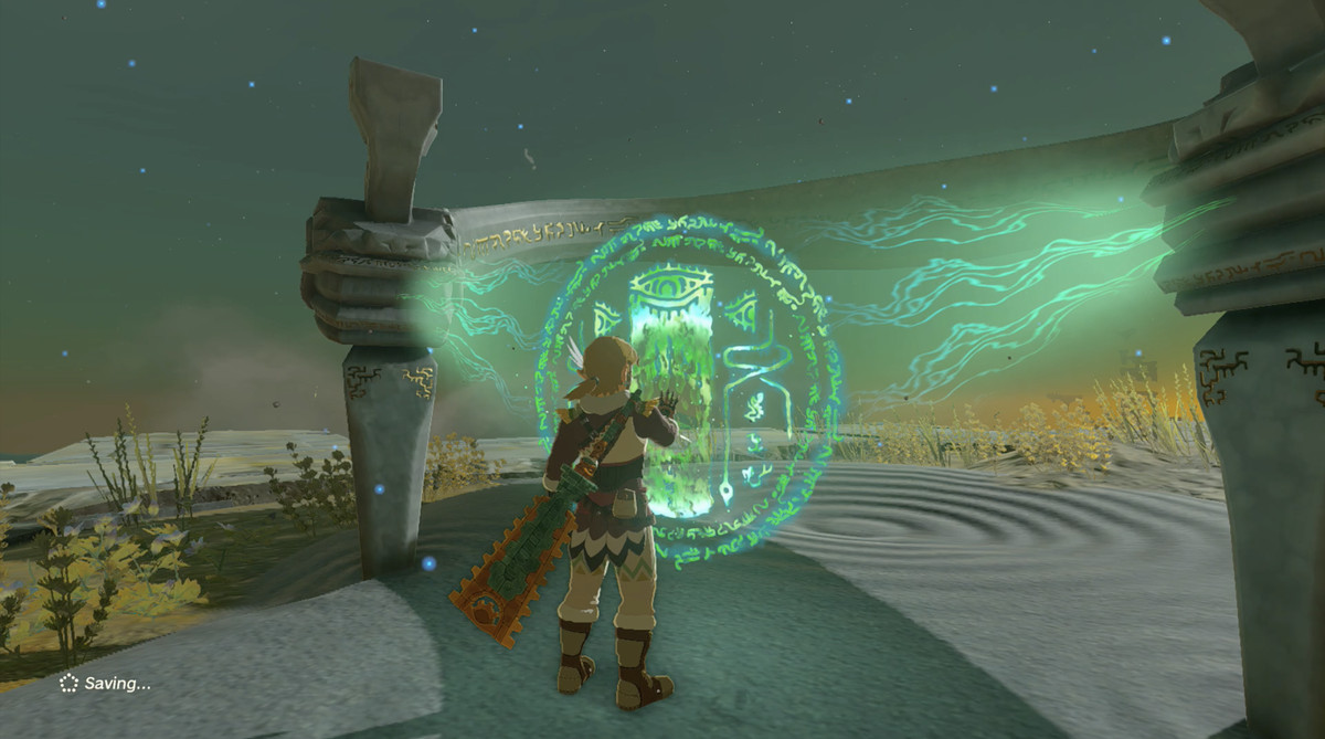 Link interacts with a shrine using his magical hand in The Legend of Zelda: Tears of the Kingdom.