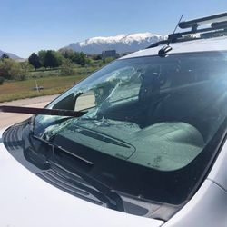 A 5-foot long metal beam flew through a woman's windshield on I-15 near Clearfield on Monday, May 13, 2019, narrowly missing the driver.